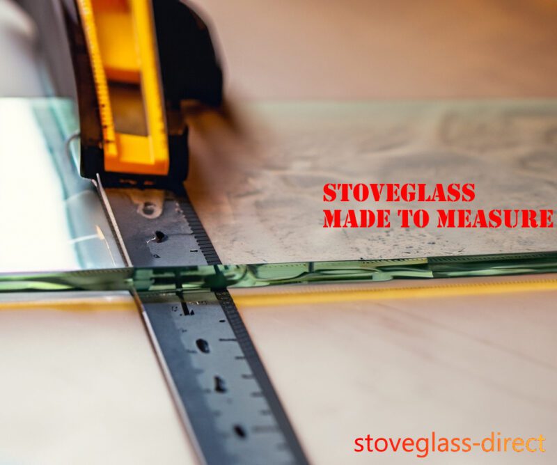 A photo of someone cutting a glass with a ruler with lettering "Stoveglass made to measure"